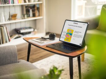 a laptop on a coffee table