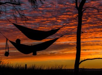 person lying on hammock