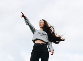 woman pointing using her right hand